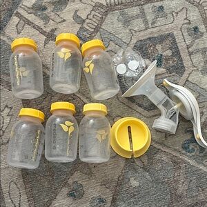 Six Medela Baby Bottles, Hand Pump, two extra filters & holder